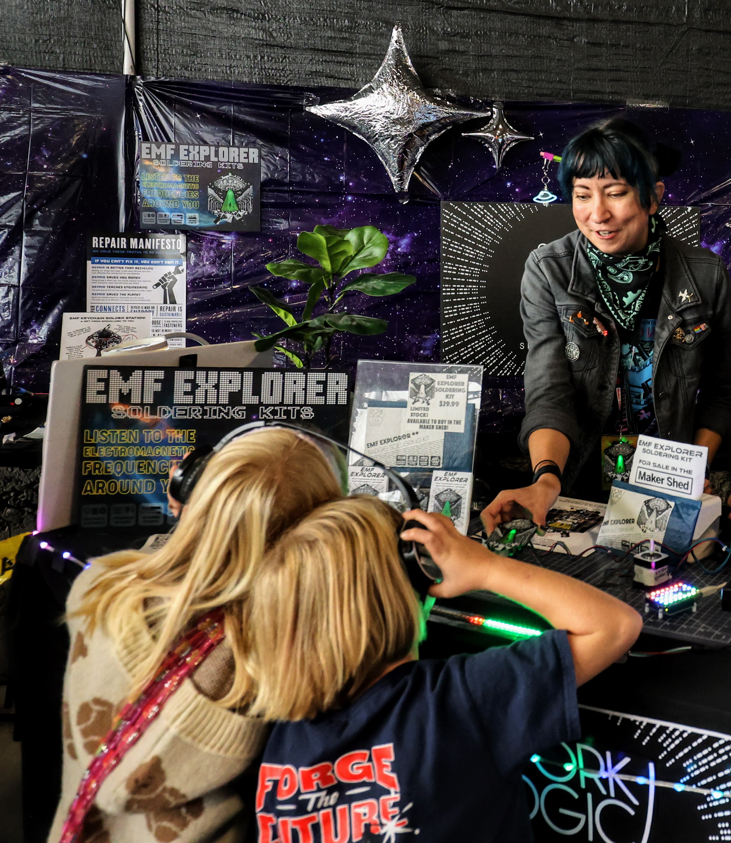 Kids building EMF Explorer badges at Maker Faire